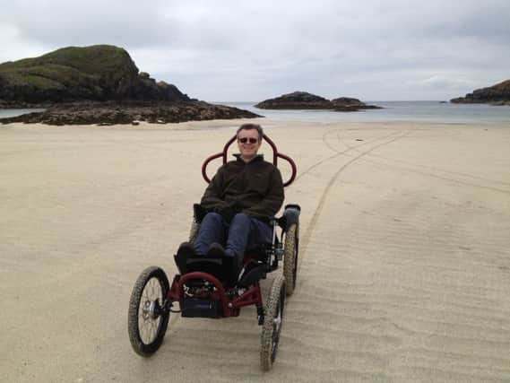 Calum Ferguson, pictured on Iona, hopes his treatment for Motor Neurone Disease can be a model for others.