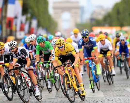 Chris Froome (centre) during stage 21 of the Tour de France in Paris. Picture: PA
