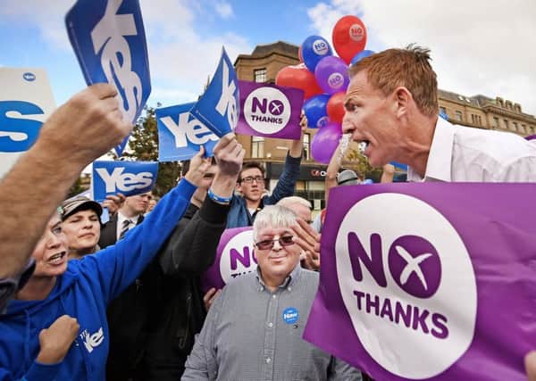 The then Labour MP Jim Murphy is engulfed by independence and Union supporters in 2014 (Picture: Getty)