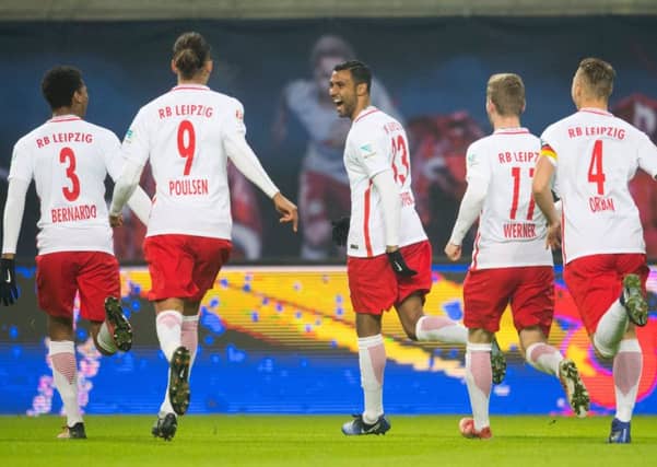 Marvin Compper (centre) celebrates with his team-mates after scoring a goal for RB Leipzig. Picture: AFP/Getty Images