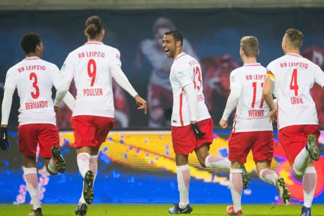 Marvin Compper (centre) celebrates with his team-mates after scoring a goal for RB Leipzig. Picture: AFP/Getty Images