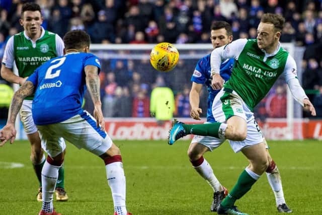 Hibs winger Brandon Barker, right, gave
Rangers full-back James Tavernier
(No 2) a torrid time. Picture: Ross Parker/SNS