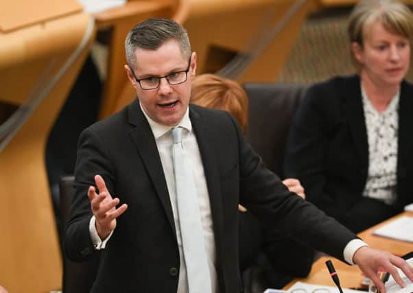 Finance Secretary Derek Mackay addresses the Scottish Parliament during the Draft Scottish Budget. Picture: Jeff J Mitchell/Getty Images)