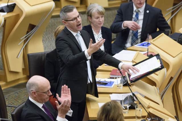 Finance Secretary Derek Mackay announced a number of changes to income tax, including increasing the charge to 21p for those earning more than Â£24,000 a year. Picture: John Linton/PA Wire