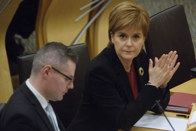 Nicola Sturgeon and finance secretary Derek Mackay at the Scottish Parliament following yesterday's draft budget announcement. Picture: PA