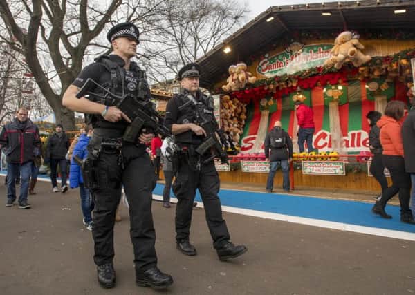 The threat of terror attacks at public gatherings, such as Edinburghs Christmas Market, has necessitated a greater role for armed police. Picture: SWNS