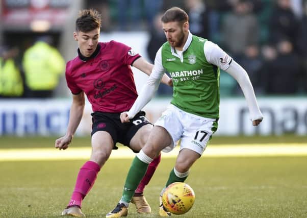 Martin Boyle, right, has stepped it up a gear since Hibs have won promotion. Picture: SNS
