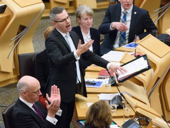 Derek Mackay delivers his Scottish budget. Picture: PA
