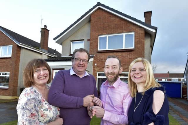 John and Kelly Davie (right) outside their new home, previously owned by David and Margaret West (left), in Kinross. Picture: Sandy Young/PA Wire
