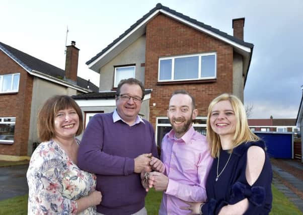 John and Kelly Davie (right) outside their new home, previously owned by David and Margaret West (left), in Kinross. Picture: Sandy Young/PA Wire