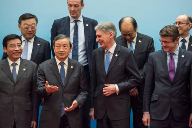 Chancellor of the Exchequer Philip Hammond and Chinese vice premier Ma Kai with other delegates at the UK-China Economic Financial Dialogue in Beijing yesterday. Picture: Getty Images
