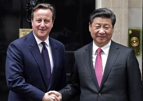 David Cameron greets Chinese President Xi Jinping at Downing Street in 2015. The former prime minister will take charge of a fund to improve ports, roads and rail networks between China and its trading partners. Picture: Getty