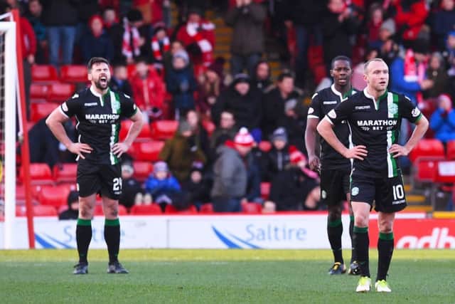 The Hibernian players deflated after the third Aberdeen goal. Picture: SNS/Craig Foy