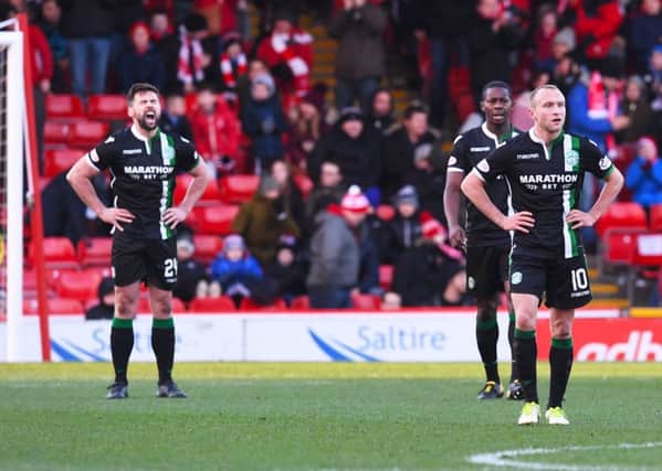The Hibernian players deflated after the third Aberdeen goal. Picture: SNS/Craig Foy