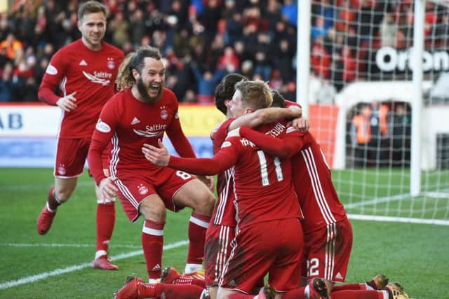 Aberdeen's Gary Mackay-Steven celebrates his hat-trick goal with his teammates. Picture: SNS/Craig Foy