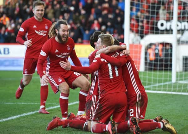 Aberdeen's Gary Mackay-Steven celebrates his hat-trick goal with his teammates. Picture: SNS/Craig Foy