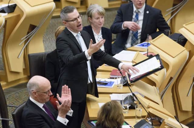 Finance Secretary Derek Mackay delivering his draft Budget for 2018-19. Picture: PA