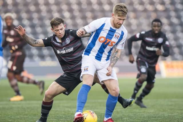 Motherwell's Craig Tanner challenges Kilmarnock's Alan Power. Picture: SNS/Alan Harvey