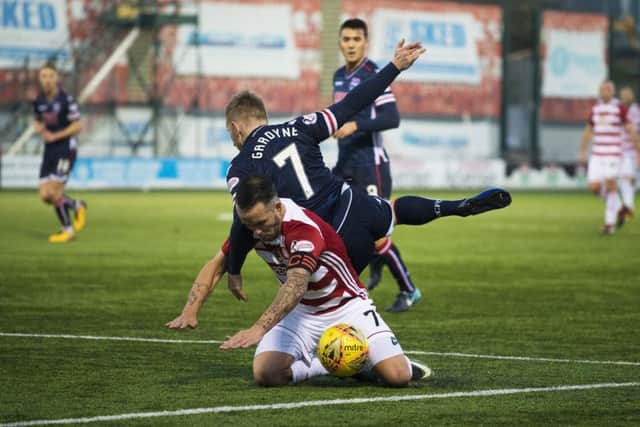 Hamilton's Dougie Imrie is fouled in the box by Michael Gardyne. Picture: SNS/Bill Murray