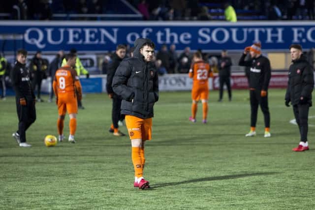 The Dundee United players walk across the pitch after the match is abandoned. Picture: SNS/Bruce White