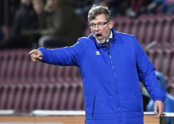 Craig Levein in front of the new main stand at Tynecastle. Picture: Rob Casey/SNS