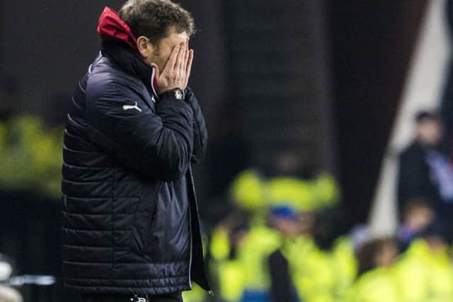 Rangers interim manager Graeme Murty can't bear to watch as his team slump to defeat against St Johnstone at Ibrox. Picture: SNS
