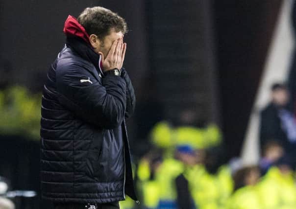 Rangers interim manager Graeme Murty can't bear to watch as his team slump to defeat against St Johnstone at Ibrox. Picture: SNS