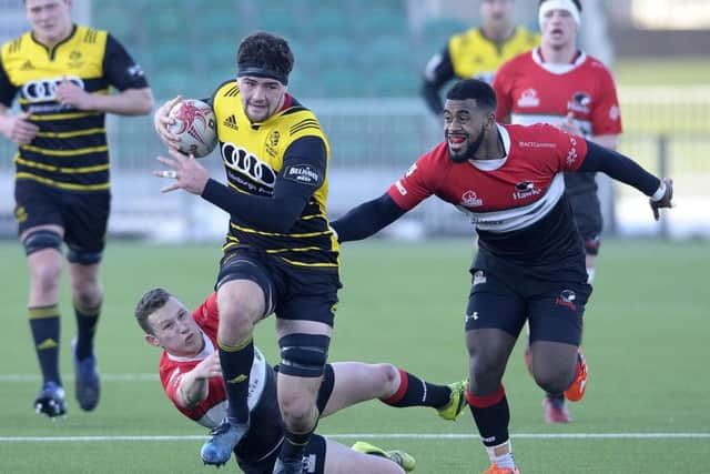 Melrose back row Ally Miller makes a break with Scott Peffers and Kyle Rowe of Hawks in pursuit at Scotstoun. Picture: Neil Hanna