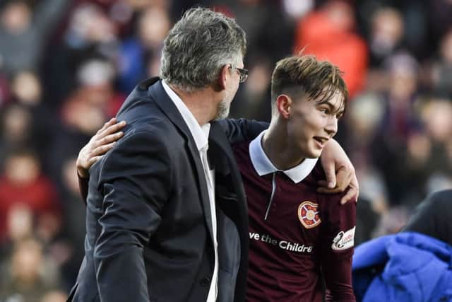 Hearts manager Craig Levein celebrates with Harry Cochrane, scorer of the opening goal, at full-time. Picture: Paul Devlin/SNS