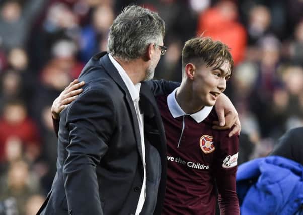 Hearts manager Craig Levein celebrates with Harry Cochrane, scorer of the opening goal, at full-time. Picture: Paul Devlin/SNS