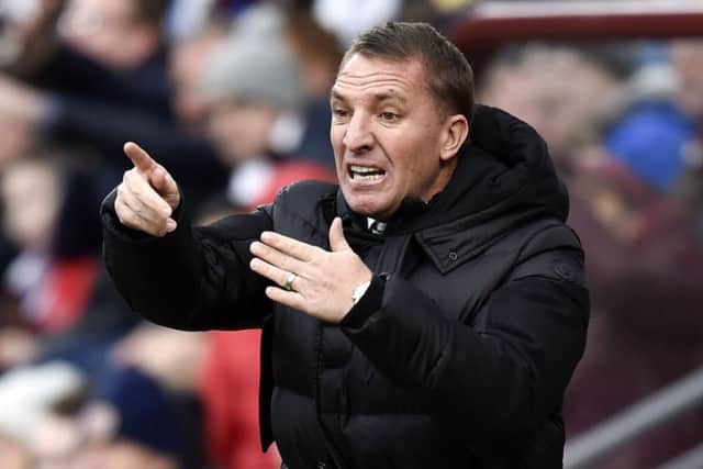 Brendan Rodgers feels the strain during Celtic's 4-0 defeat by Hearts at Tynecastle.