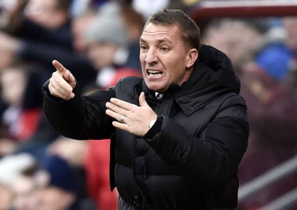 Brendan Rodgers feels the strain during Celtic's 4-0 defeat by Hearts at Tynecastle.
