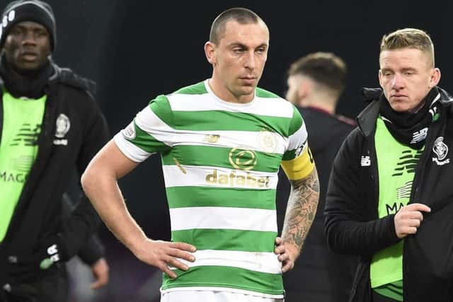 Scott Brown looks dejected after Celtic suffer a 4-0 defeat away to Hearts, ending their 69-game unbeaten run. Picture: PA