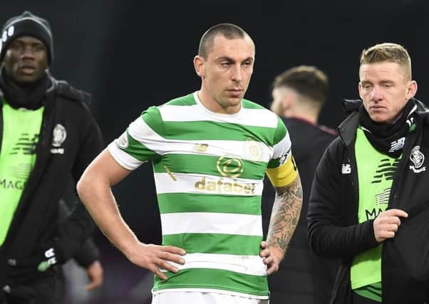 Scott Brown looks dejected after Celtic suffer a 4-0 defeat away to Hearts, ending their 69-game unbeaten run. Picture: PA