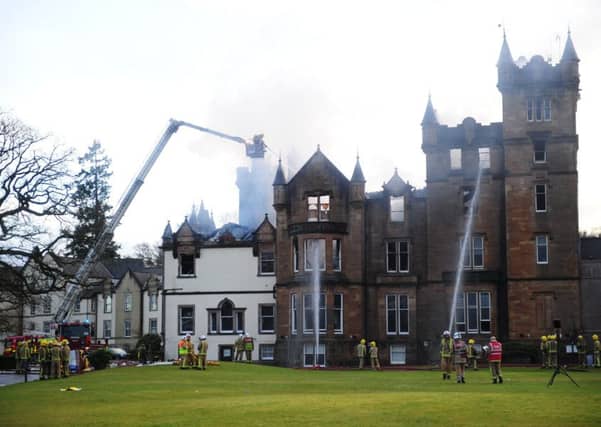 Firefighters at the scene following the fire at the Cameron House Hotel. Picture: Mike Gibbons/PA Wire