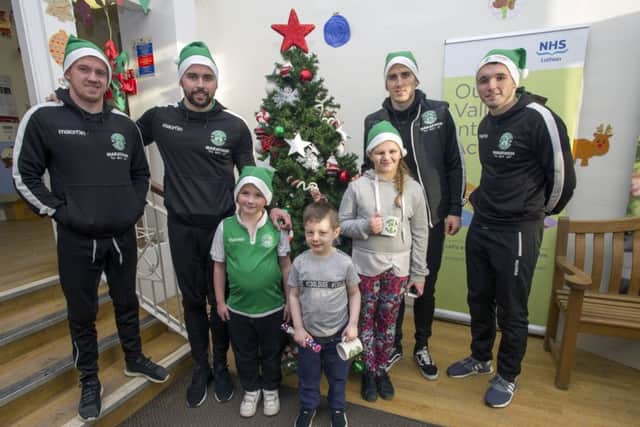 From left to right, Reece Hunter-Little, Quinn Martin and Chantelle Cummings meet Danny Swanson, Darren McGregor, Paul Hanlon and John McGinn at the Sick Kids. Picture: Ian Rutherford