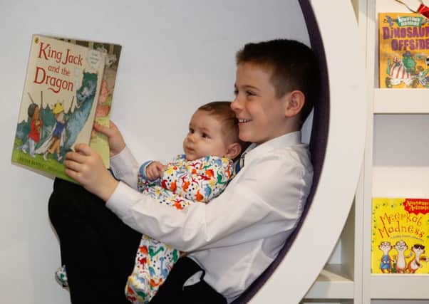 Jack Shepherd, 10, with four-month-old Jack Capes-Carr at The Children's Library in Edinburgh.