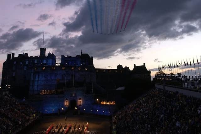 The Red Arrows fly in formation over Edinburgh Castle during the Tattoo. Picture: Rob McDougall