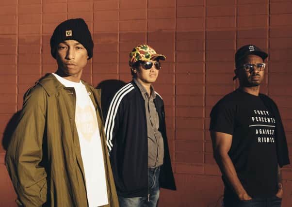 Pharrell Williams (left) with his N.E.R.D. collaborators, Chad Hugo and Shae Haley. Picture: Graham Walzer/The New York Times