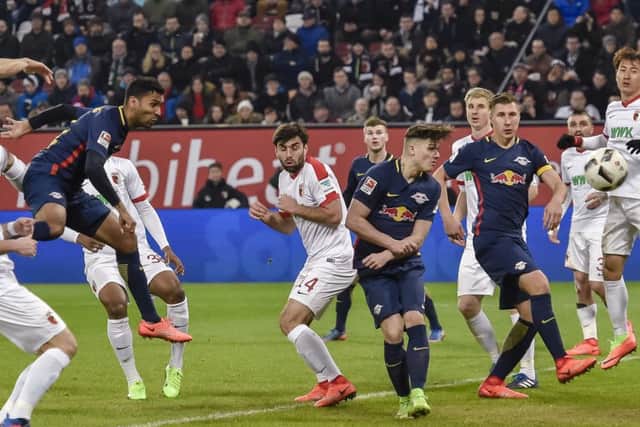 Leipzig defender Marvin Compper scores against FC Augsburg last season.