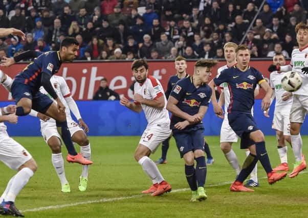 Leipzig defender Marvin Compper scores against FC Augsburg last season.