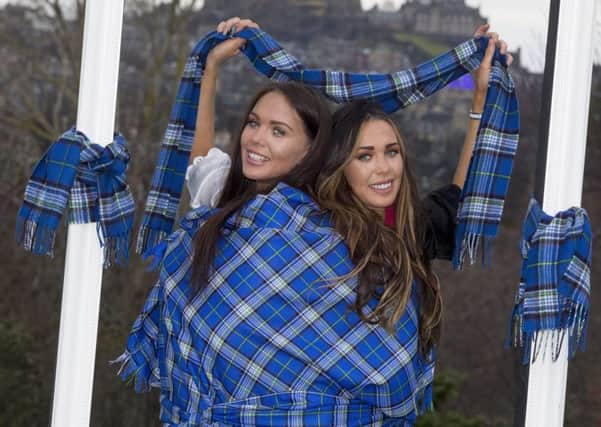 Mental health nurse Louisa Thomson, finalist of this years Miss Great Britain and her sister Cristina, model the world's first Mental Health charity tartan. Picture: SWNS