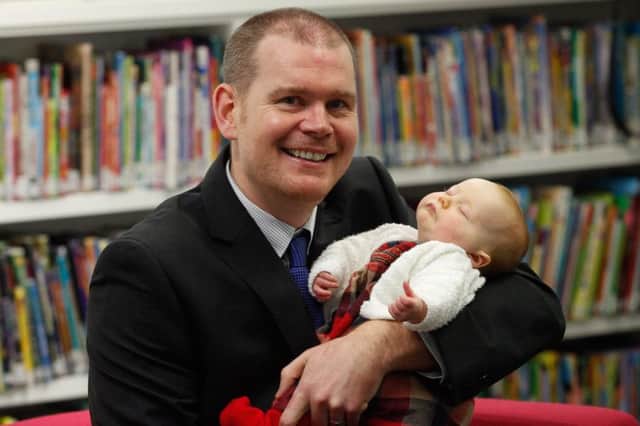 Alan Ferrier, head of demographic statistics at the National Records Of Scotland, with daughter Megan. Picture: Scott Loudon