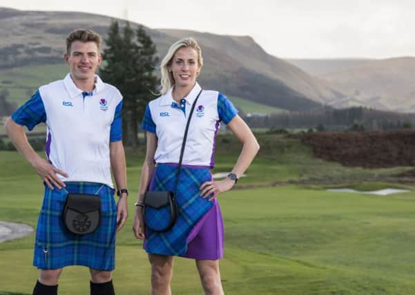 Athletes Andrew Butchart and Lynsey Sharp model the Team Scotland parade uniform for next year's Commonwealth Games
opening ceremony. The outfits were designed by Siobhan Mackenzie and created by tartan manufacturers House of Edgar. Picture: Alistair Devine