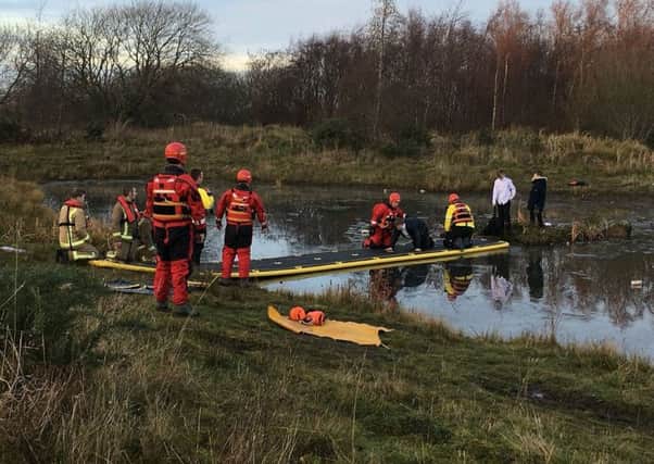 Three schoolboys were rescued by firefighters after being trapped on a tiny island surrounded by icy water. Picture: SWNS