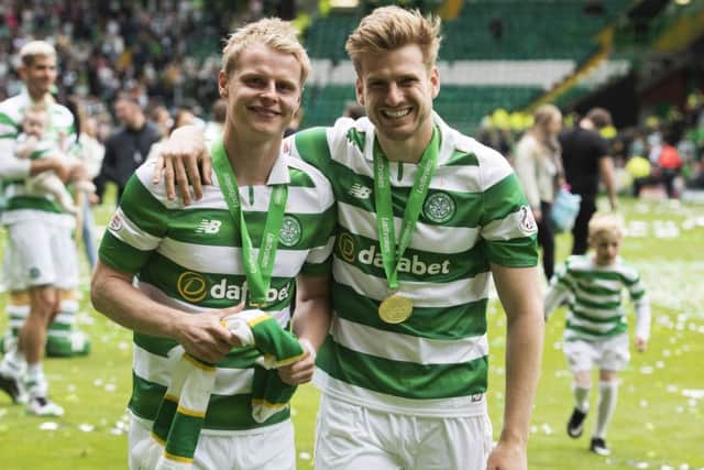 Gary Mackay-Steven, left, and Stuart Armstrong celebrate Celtic's title success in May. Picture: SNS
