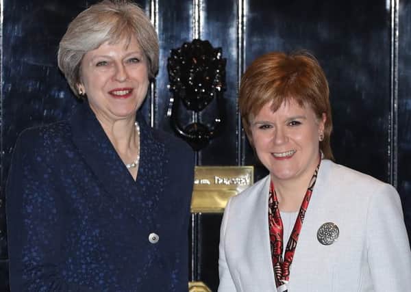 Theresa May has so far resisted Nicola Sturgeon's efforts to get a seat at the Brexit talks with the EU (Picture: Getty)
