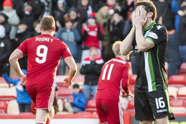 Don't look now: Hibernian's Lewis Stevenson is left dejected as Gary Mackay-Steven opens the scoring for Aberdeen. Picture: Sammy Turner/SNS