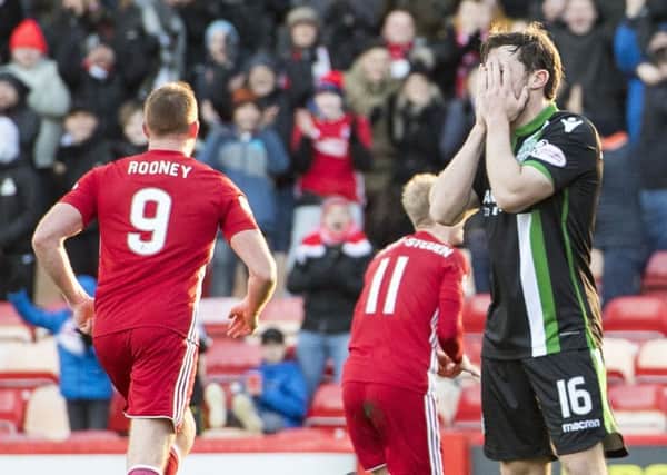 Don't look now: Hibernian's Lewis Stevenson is left dejected as Gary Mackay-Steven opens the scoring for Aberdeen. Picture: Sammy Turner/SNS