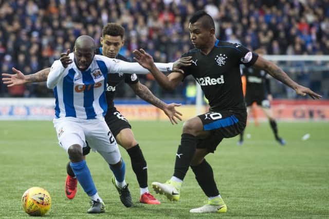 Kilmarnock's Youssouf Mulumbu holds off Alfredo Morelos. Picture: SNS/Alan Harvey